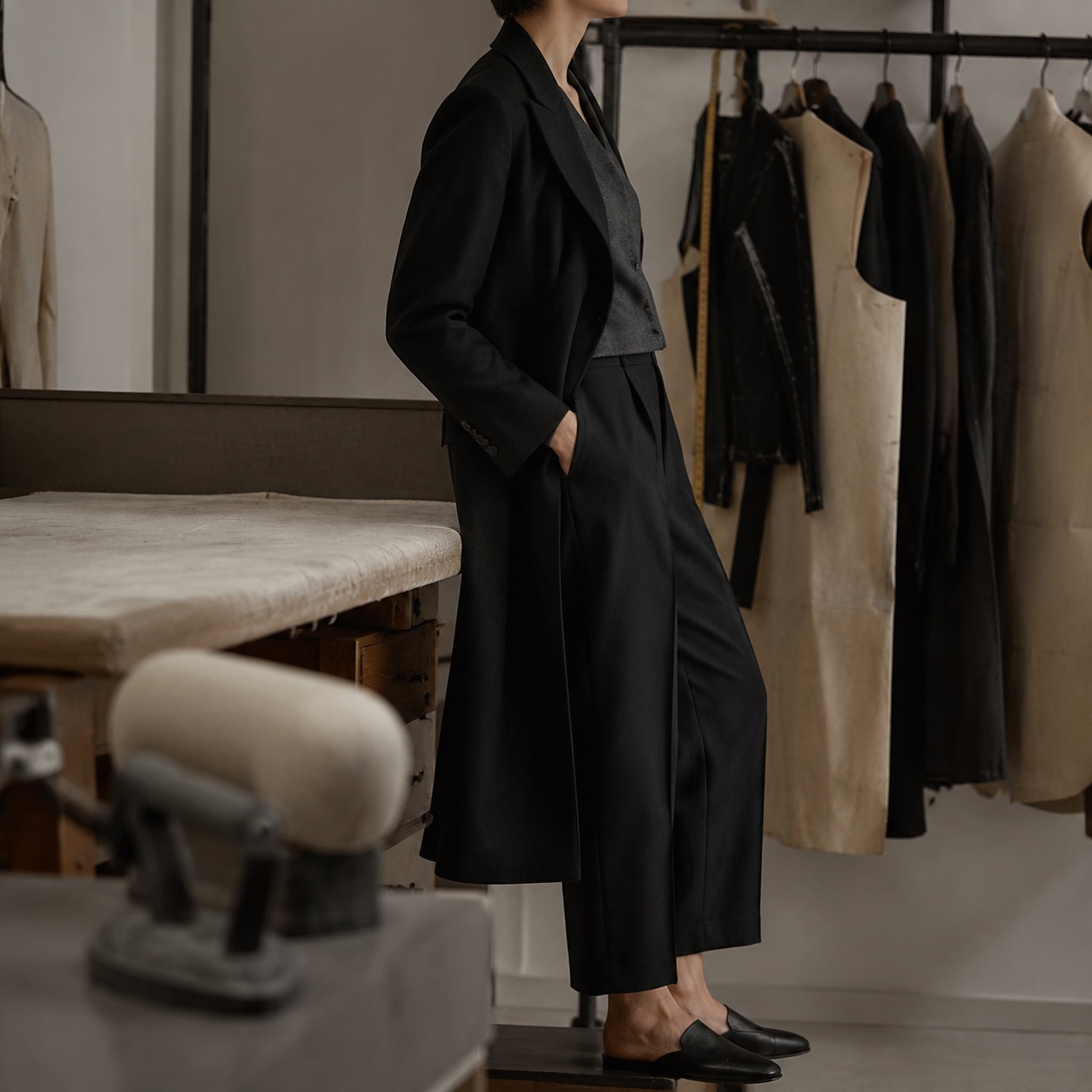 Ashdown long-line tailored coat jacket — Suit Jackets by CROWN TAILORING. shown on the model from the side.