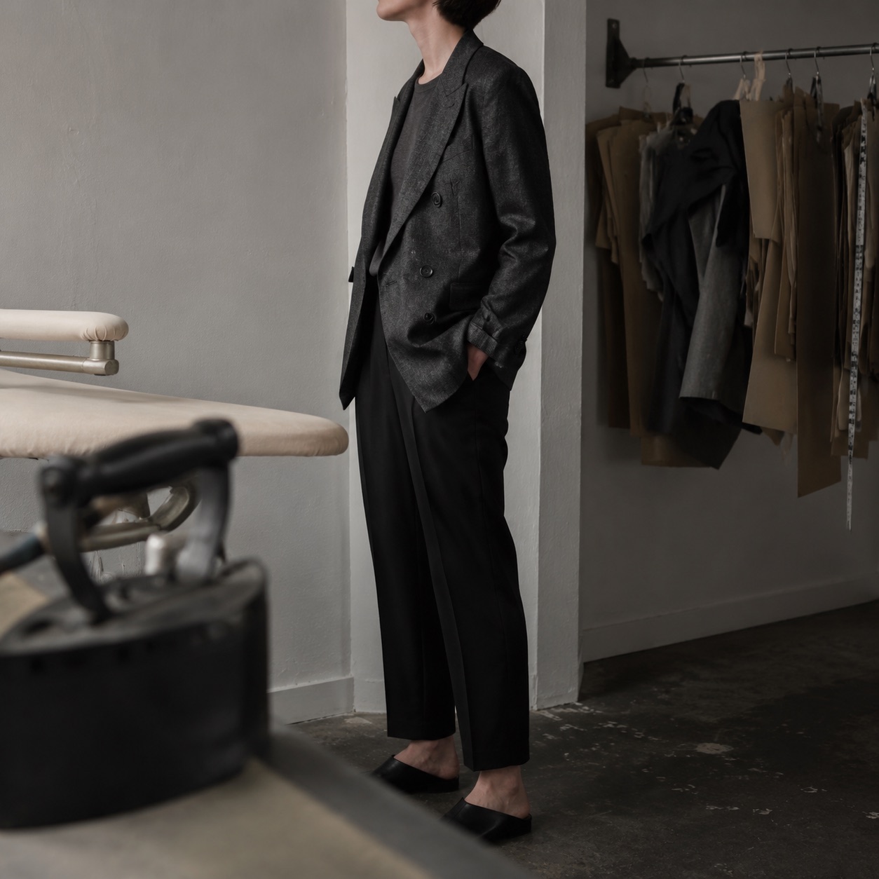 Dartmoor double-breasted suit jacket — Suit Jackets by CROWN TAILORING. worn by a model, side view.
