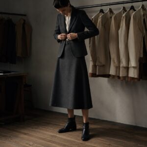 Sloe A-line midi skirt — Tailored Skirts by CROWN TAILORING. worn by a model.