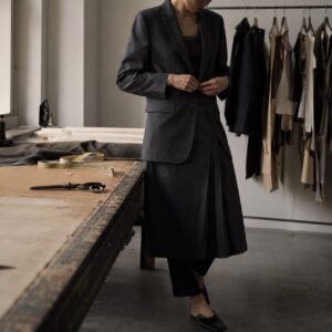 Fitzrovia box-pleated wrap skirt — Tailored Skirts by CROWN TAILORING. worn by a model.