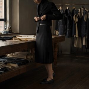 Holborn box-pleated wrap skirt — Tailored Skirts by CROWN TAILORING. worn by a model.