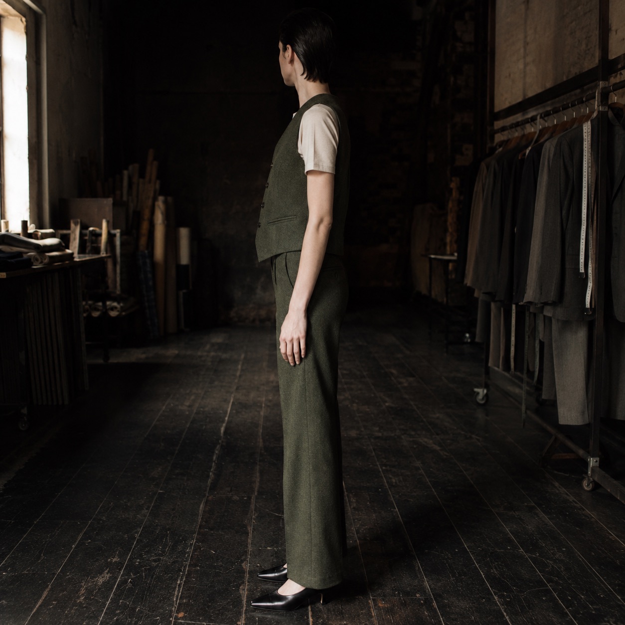 Fitzrovia single-breasted waistcoat — Waistcoats by CROWN TAILORING. worn by a model, side view.